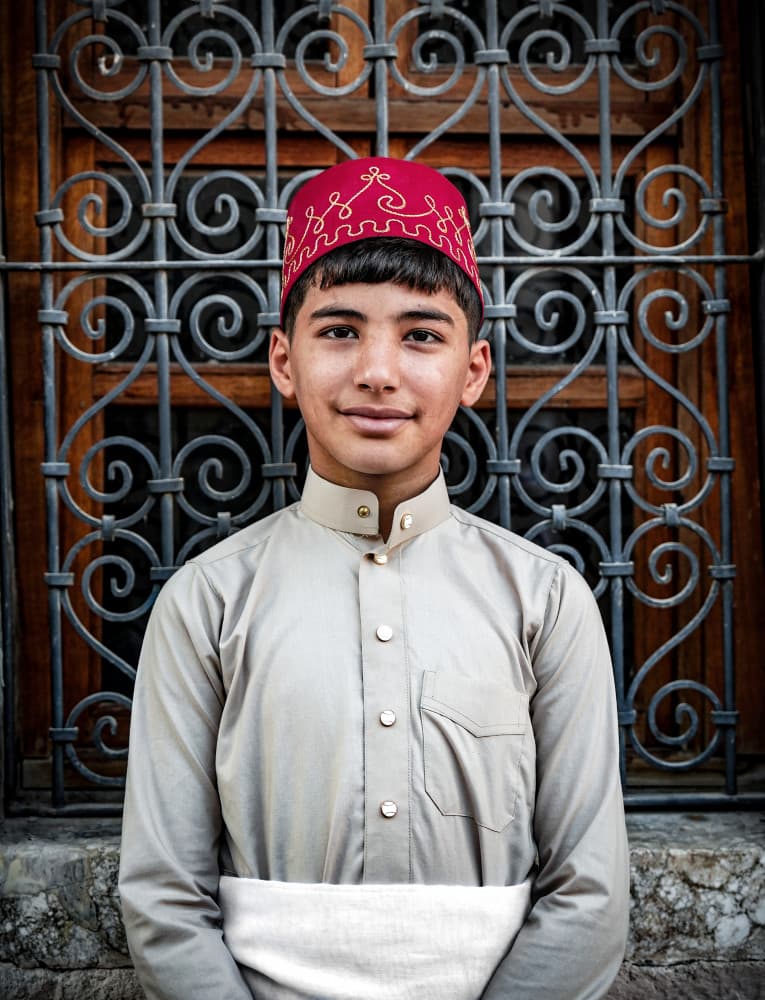 Smiling Youth in Fez by Bashar Alsofey — canvas wall art