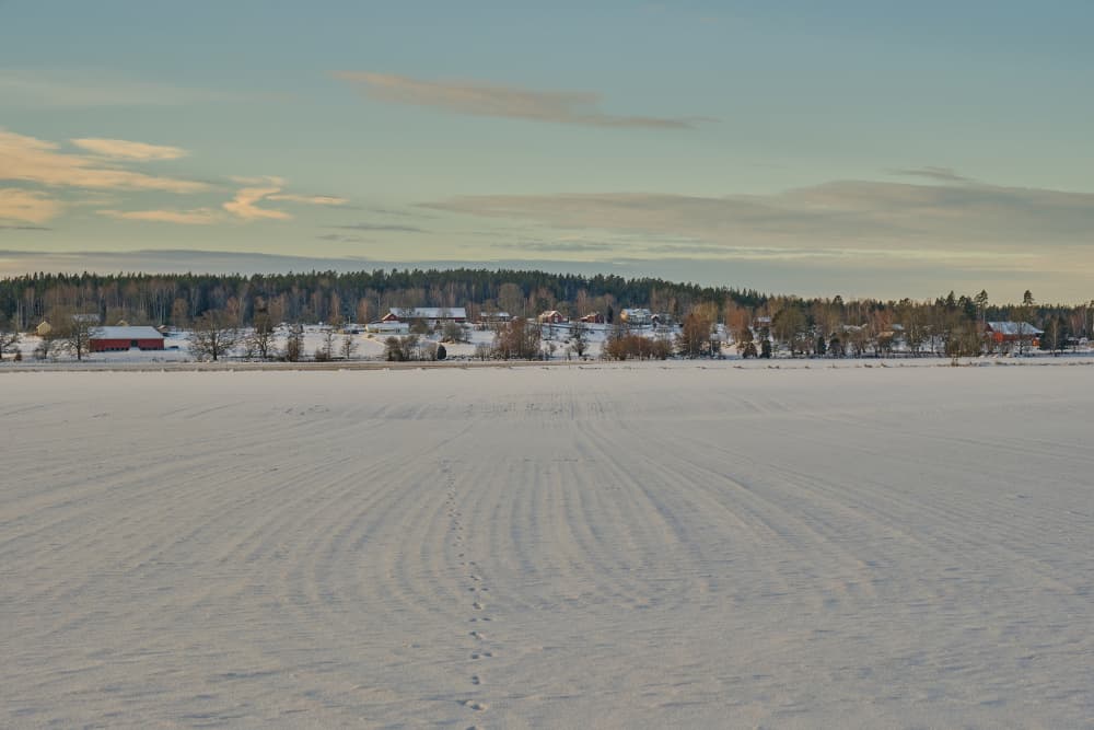 Snowy Countryside Village by Geertjan Plooijer — canvas wall art
