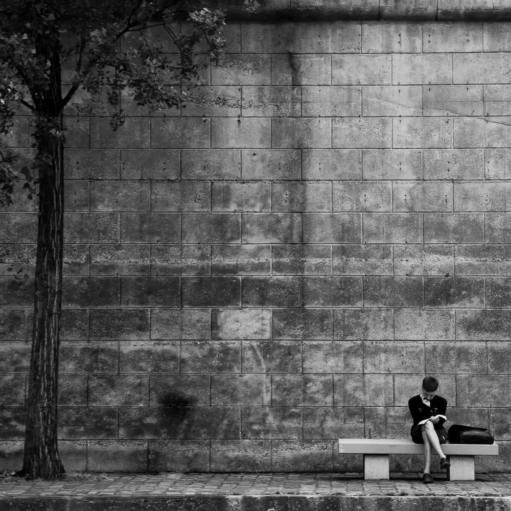 Quiet Reading on Bench by Ali Khataw — canvas wall art