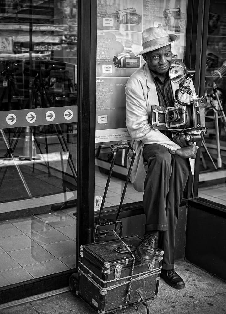 Smiling Street Photographer by Goran Jovic — canvas wall art