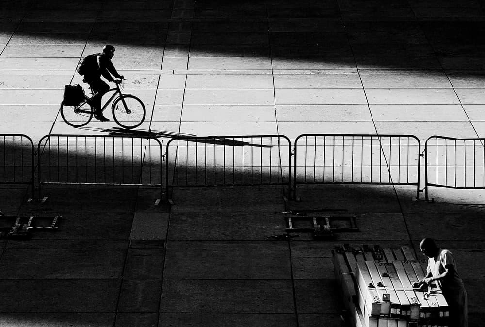 Urban Cyclist Silhouette by Jian Wang — canvas wall art