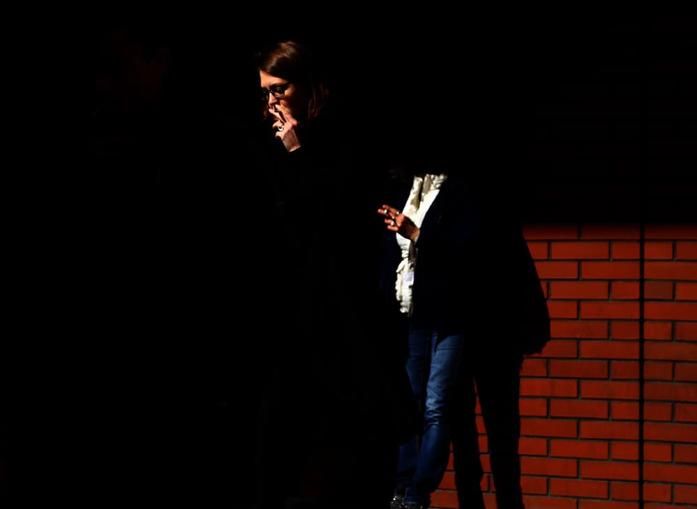 Woman Smoking in Shadows by Anna Niemiec — canvas wall art