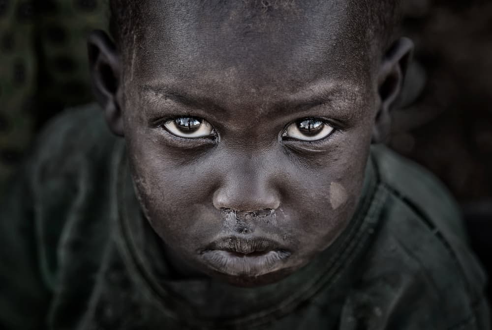 Intense Child's Gaze by Joxe Inazio Kuesta Garmendia — canvas wall art