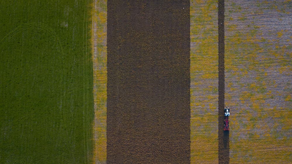 Tractor Plowing Fields by Kutub Uddin — canvas wall art