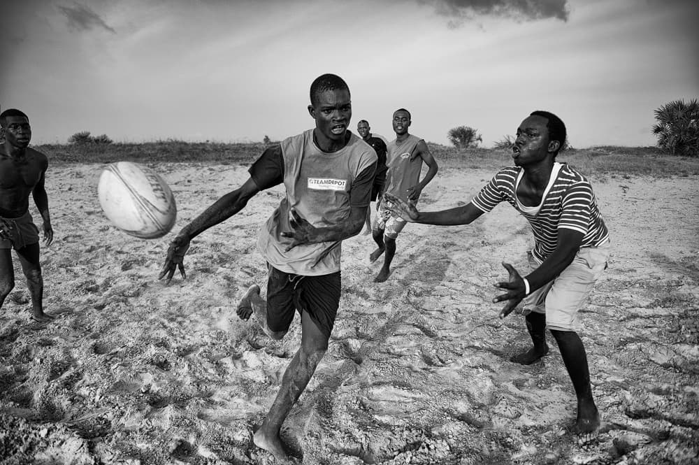 Rugby Pass On Sand by Marcel Rebro — canvas wall art