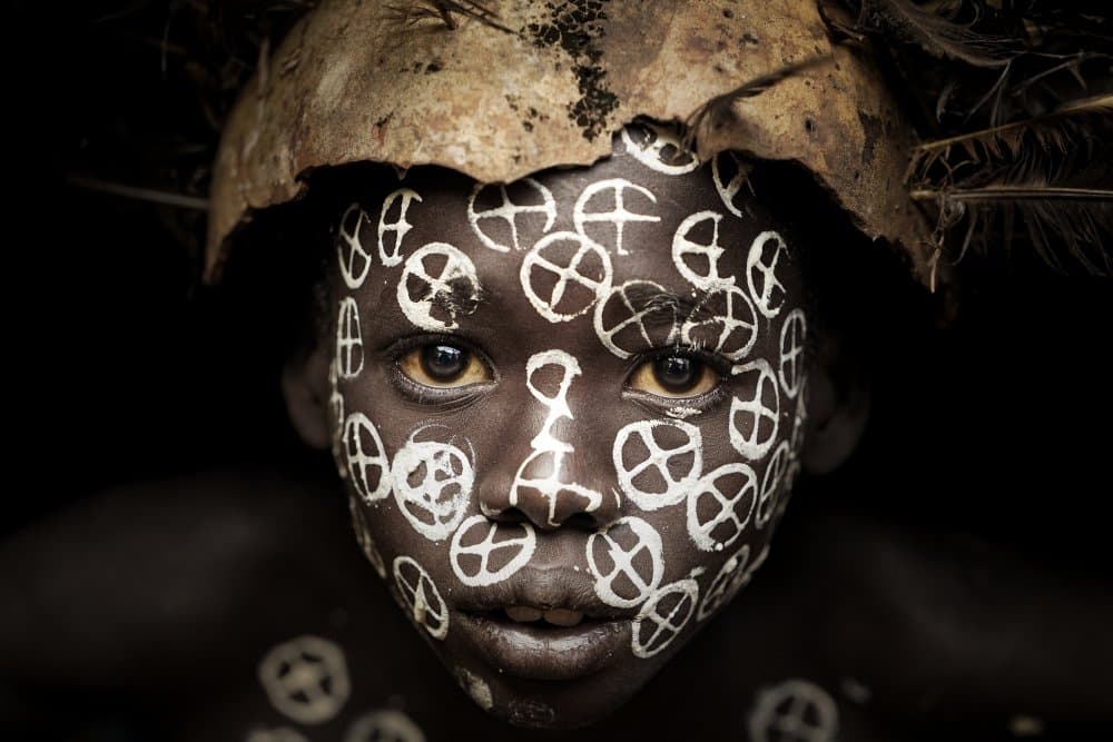 Tribal Face Paint Portrait by Sarawut Intarob — canvas wall art