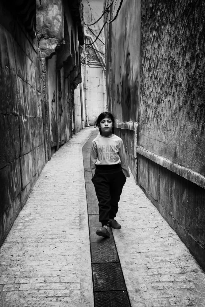 Child in Urban Alley by Jalili — canvas wall art