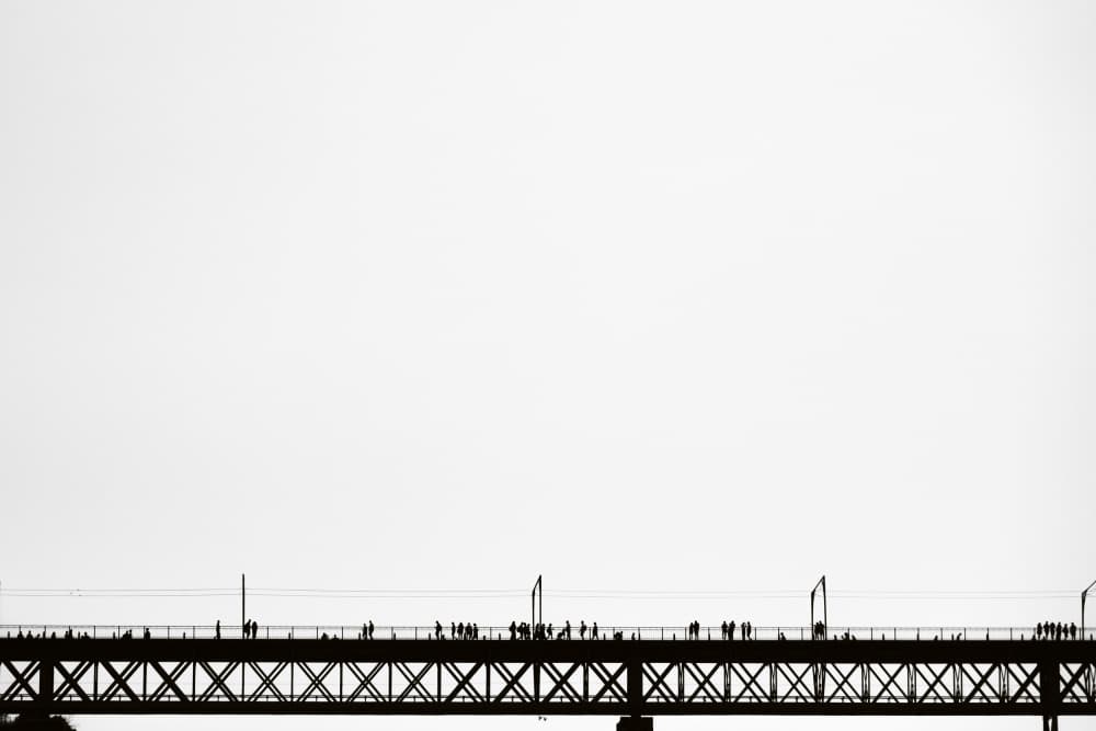 Silhouetted Figures on Bridge by Vito Muolo — canvas wall art