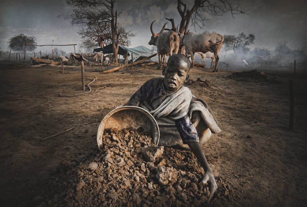African Child Sifting Earth by Svetlin Yosifov — canvas wall art