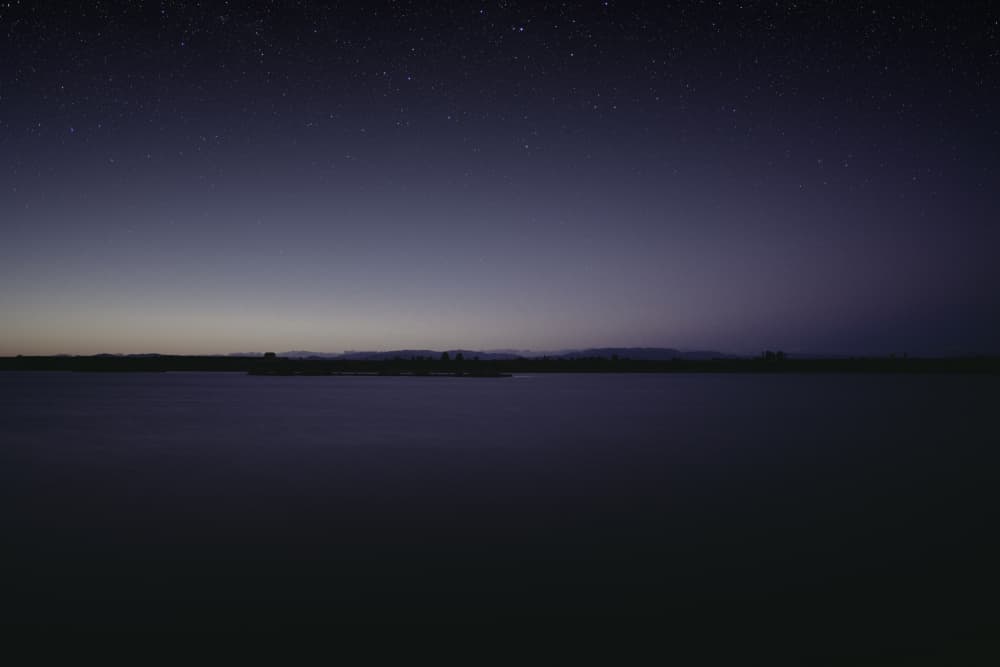 Starry Night Over Calm Water by Javier Pardina — canvas wall art