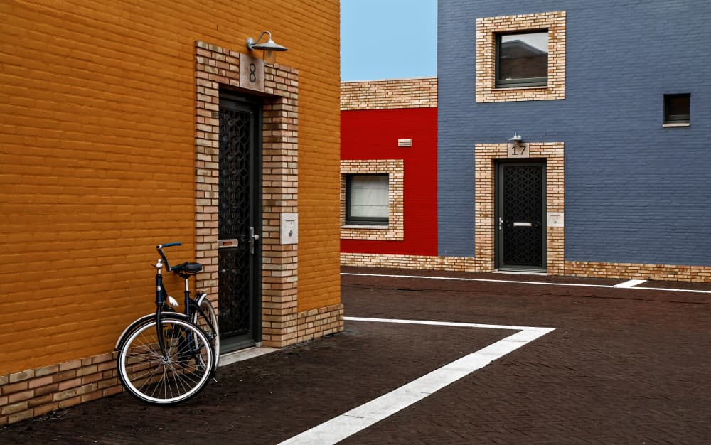 Colorful Urban Homes by Gilbert Claes — canvas wall art