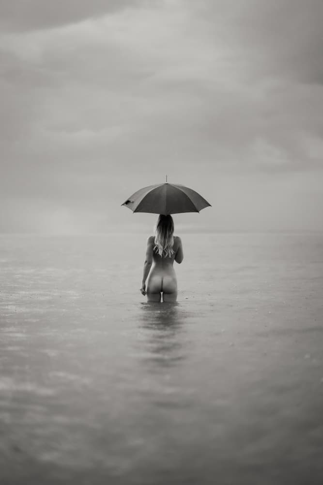 Solitary Woman Rain Umbrella by James Graf — canvas wall art