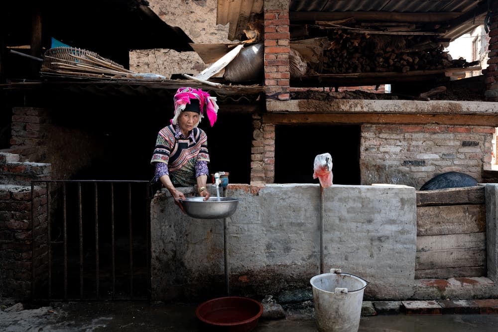 Traditional Woman Washing by Roberto Marchegiani — canvas wall art