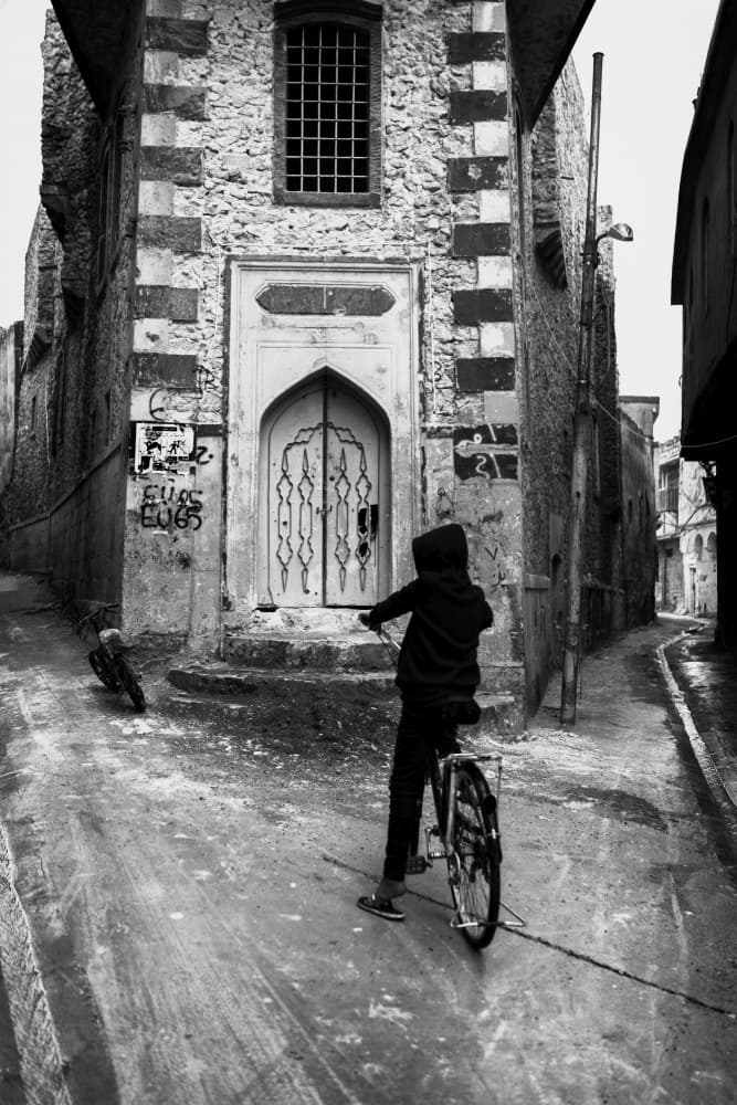 Hooded Child Old City by Jalili — canvas wall art