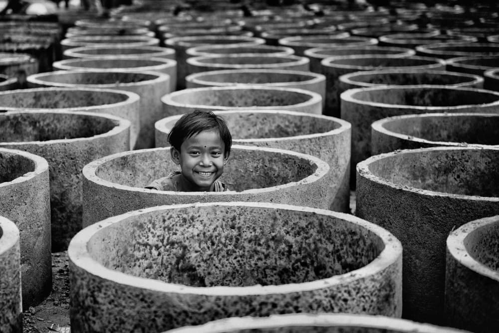 Happy Child Among Rings by Avishek Das — canvas wall art