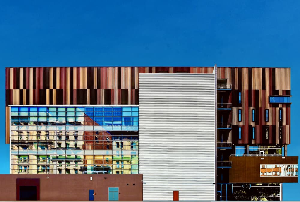 Modern Building Reflections by Arnon Orbach — canvas wall art