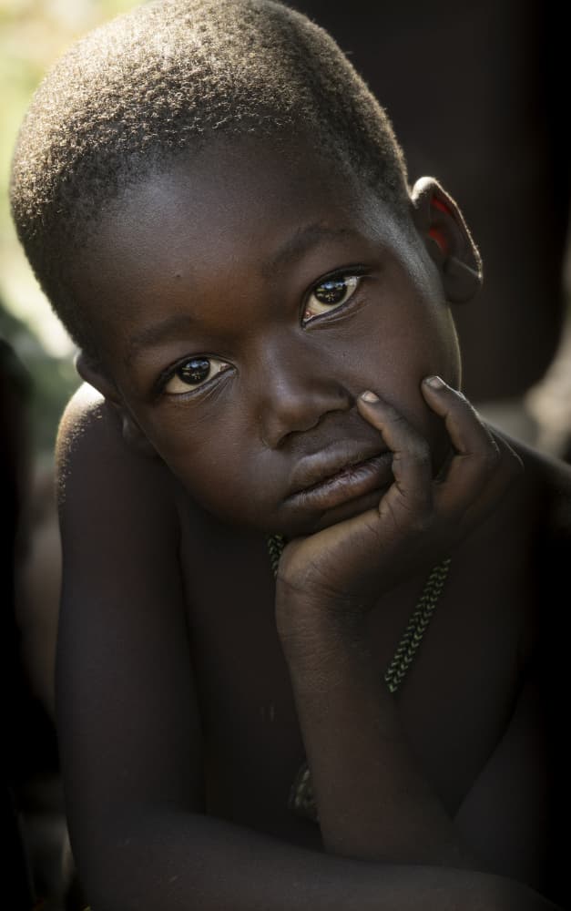 Pensive Young Boy by Elena Molina — canvas wall art