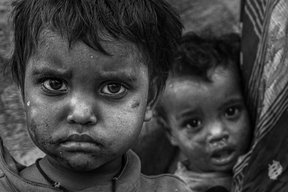 Solemn Children's Faces by Kuntal Biswas — canvas wall art