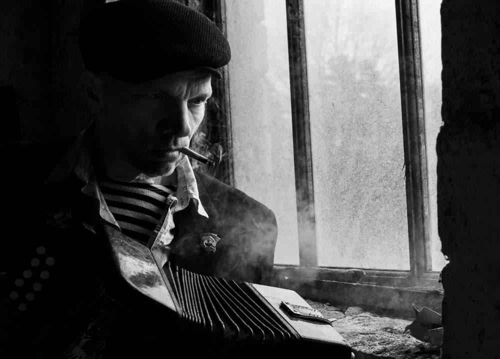 Pensive Musician Smoking by Viktor Cherkasov — canvas wall art