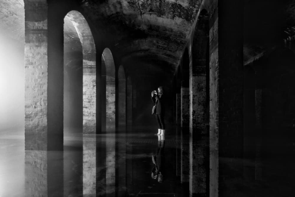 Lone Figure Dark Arches by Leif Løndal — canvas wall art