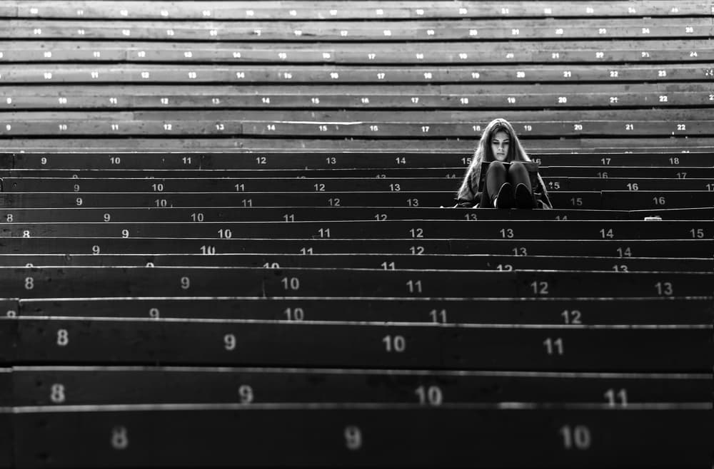 Pensive Girl Stadium Steps by Anna Niemiec — canvas wall art