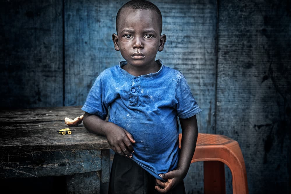Boy in the streets of Accra - Ghana. by Joxe Inazio Kuesta Garmendia — canvas wall art
