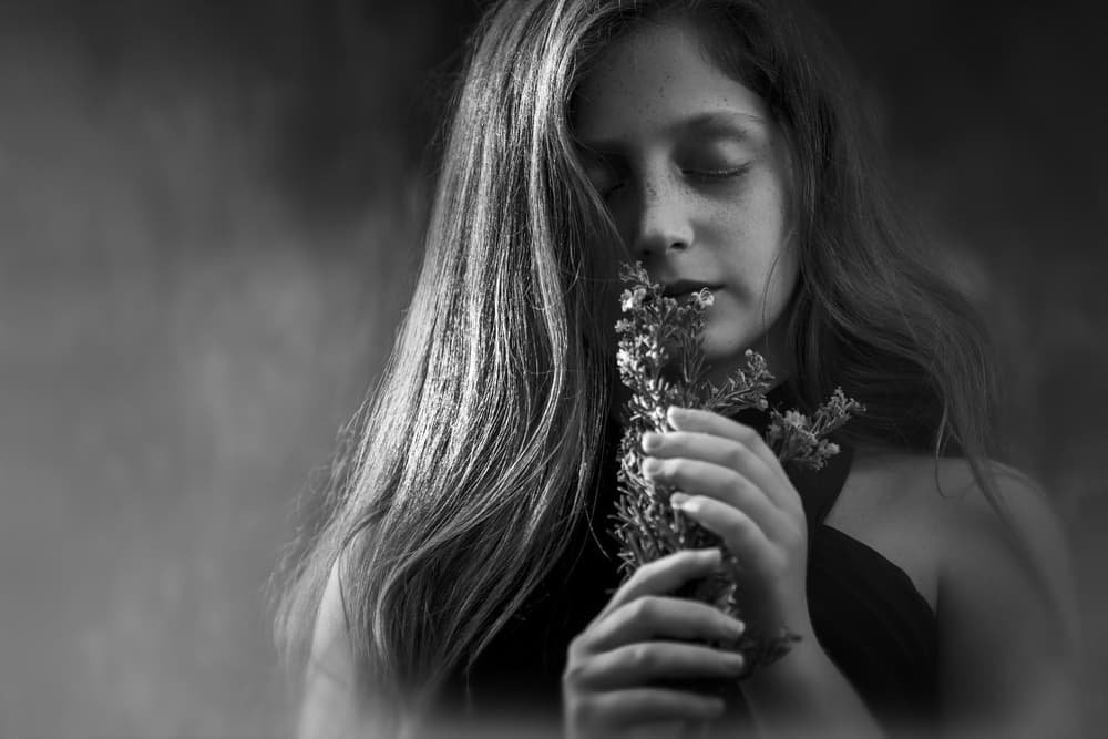 Serene Girl Smelling Flowers by AYMAN KHRBAWE — canvas wall art