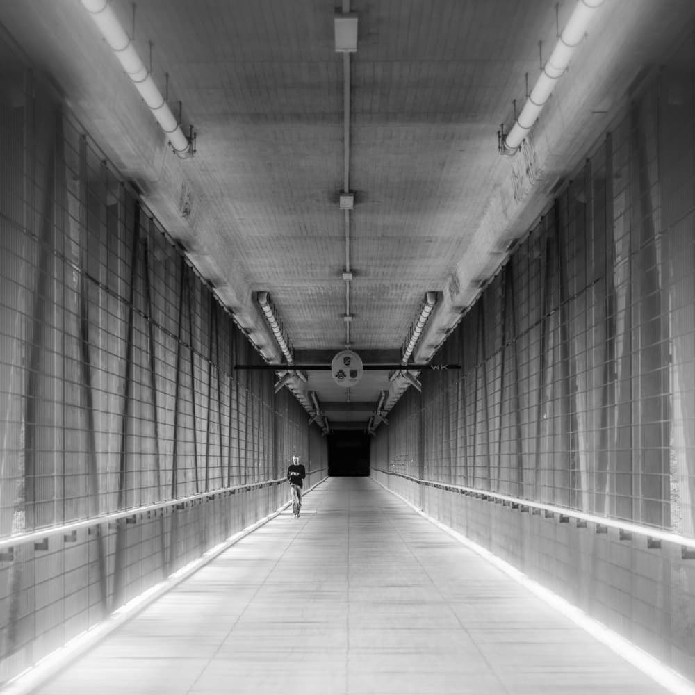 Lone Cyclist in Tunnel by Andy Dauer — canvas wall art