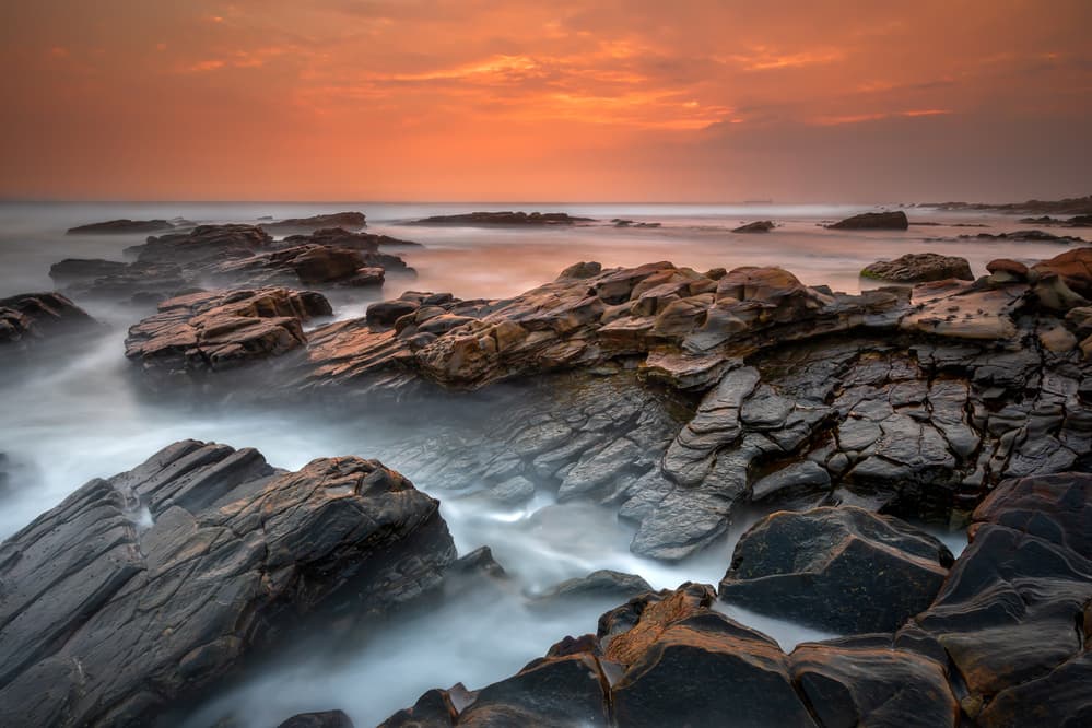 Dramatic Coastal Rocks Glow by Gunarto Song — canvas wall art