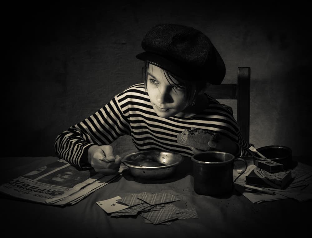 Young Boy's Quiet Meal by Viktor Cherkasov — canvas wall art