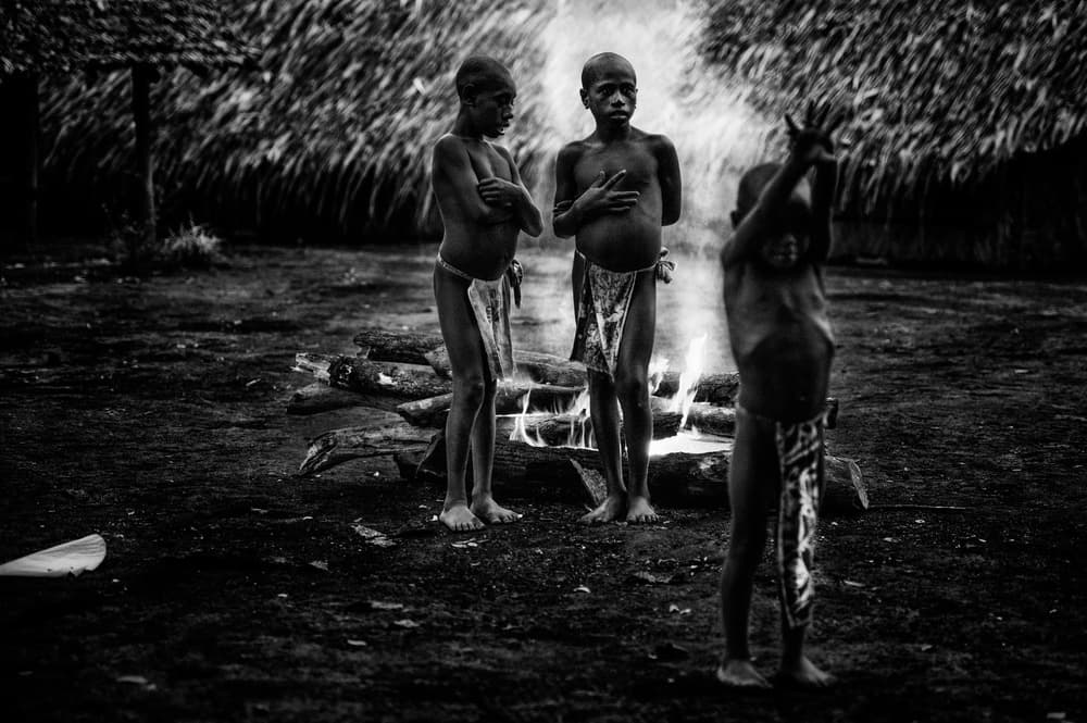 Boys By The Fire by Joxe Inazio Kuesta Garmendia — canvas wall art