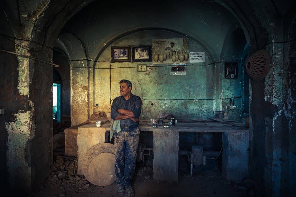 Artisan in Rustic Studio by Marco Tagliarino — canvas wall art