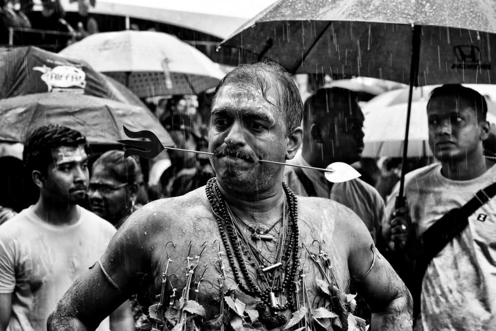 Thaipusam Rain Devotion by Kieron Long — canvas wall art