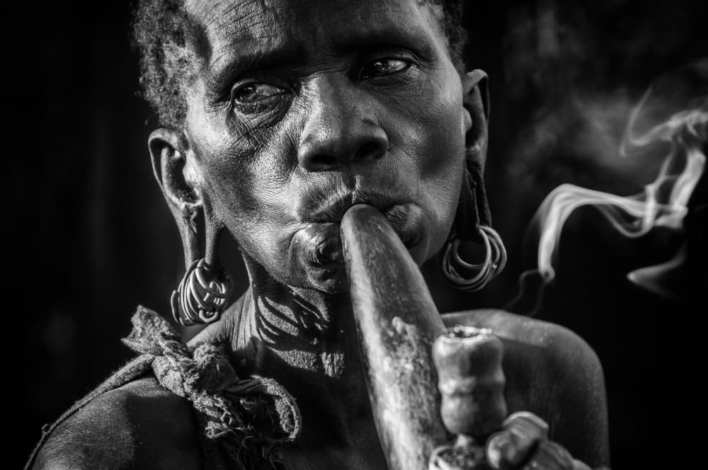 Tribal Woman Smoking Pipe by Trevor Cole — canvas wall art