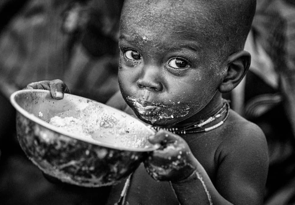Soulful Child Eating by Joxe Inazio Kuesta Garmendia — canvas wall art