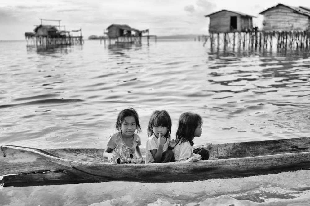 Water Village Children by Kieron Long — canvas wall art