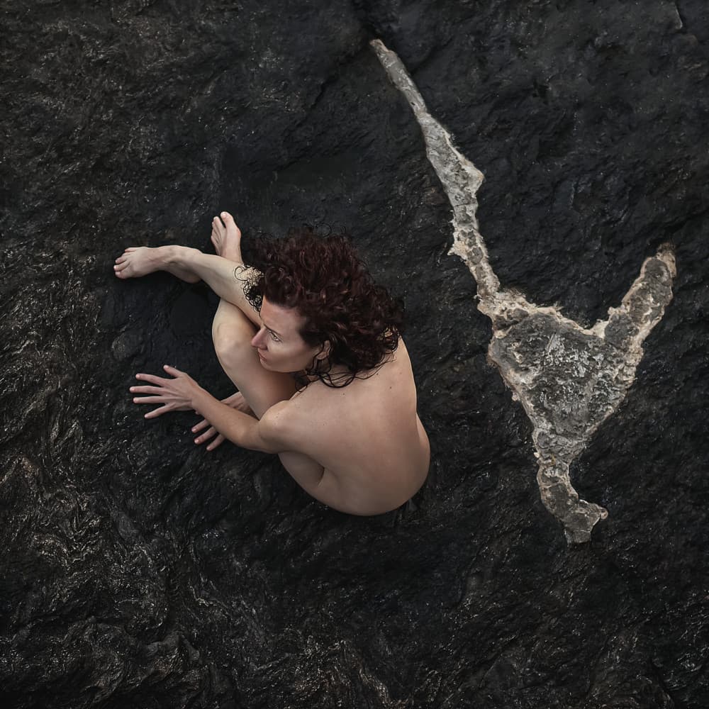 Nude Woman on Dark Rock by michel genève — canvas wall art