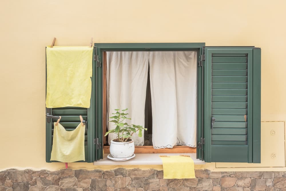 Green Shutters Yellow House by Photolovers — canvas wall art