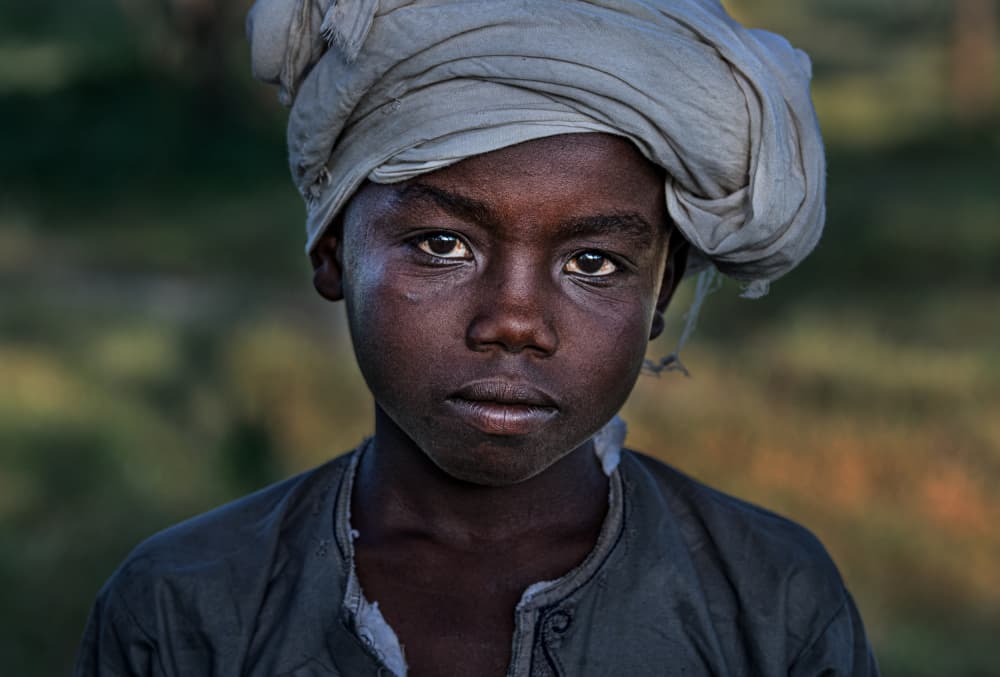 Pensive African Boy by Joxe Inazio Kuesta Garmendia — canvas wall art