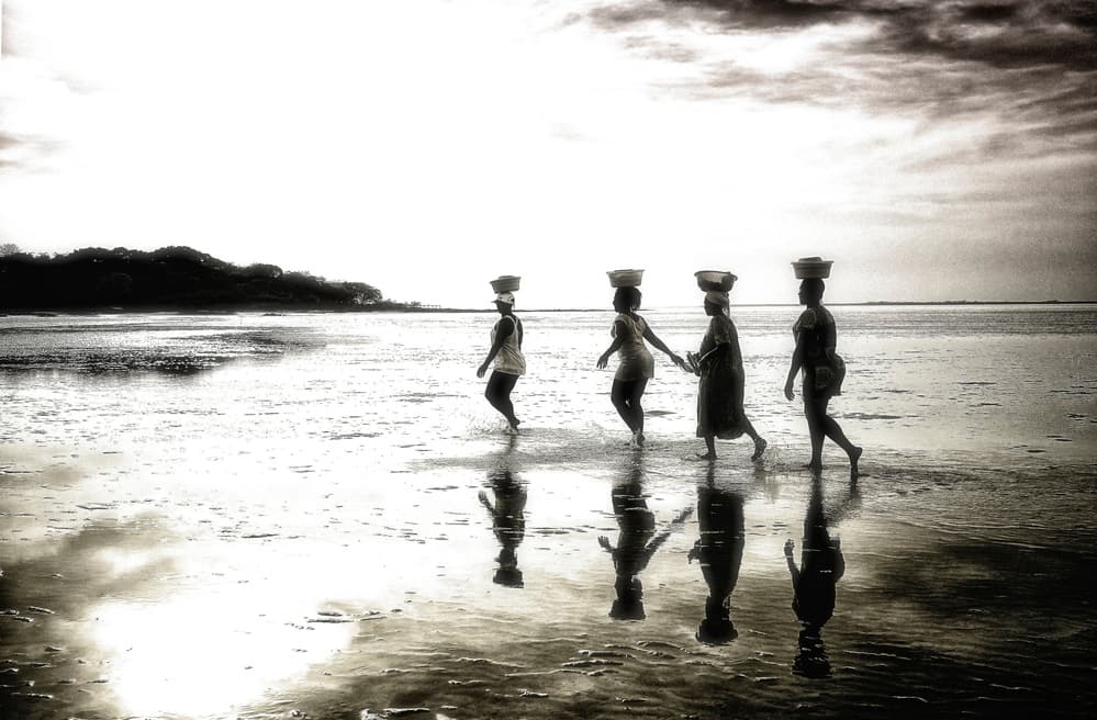 Women Walking Water Reflections by Elena Molina — canvas wall art