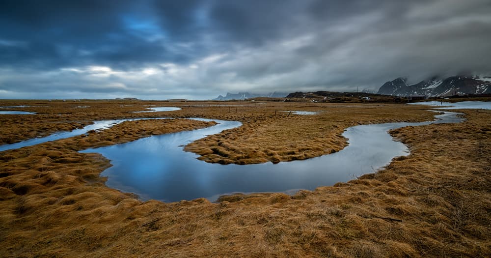 Dramatic Marsh River Mountains by Bjoern Alicke — canvas wall art