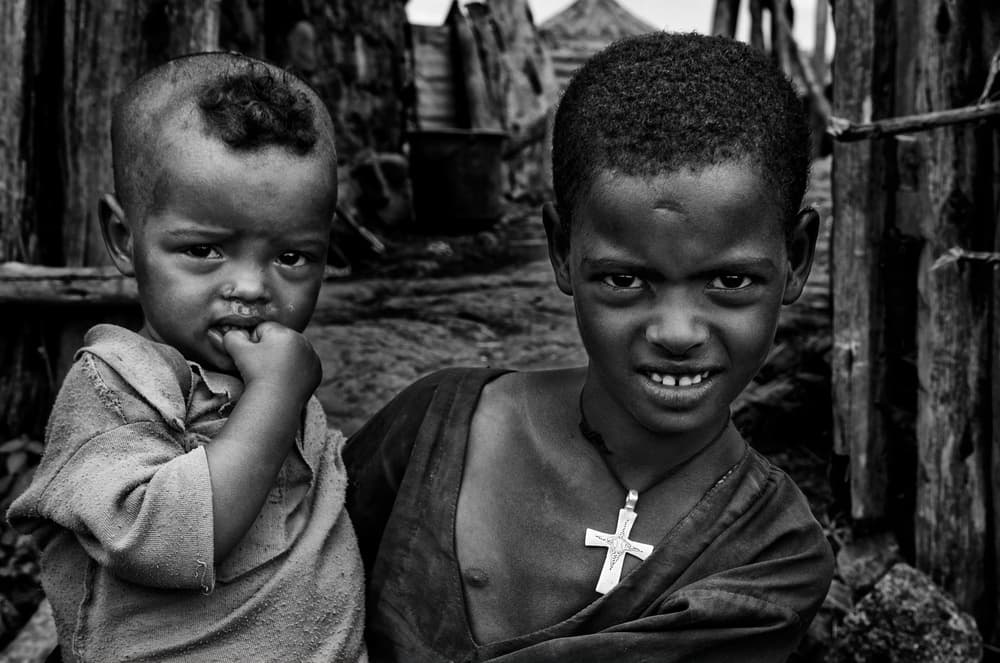 African Boys Expressions by Joxe Inazio Kuesta Garmendia — canvas wall art