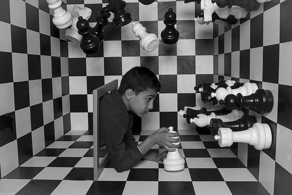 Boy In Chess Illusion by Eyal Amer — canvas wall art