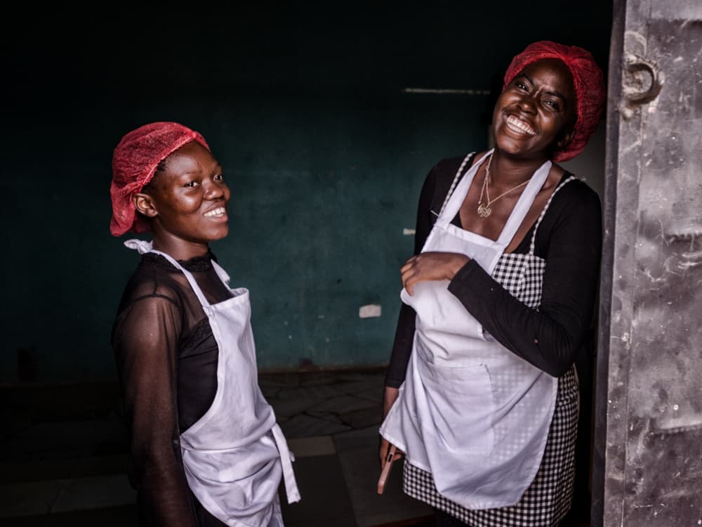 Smiling Women in Aprons by Pavol Stranak — canvas wall art
