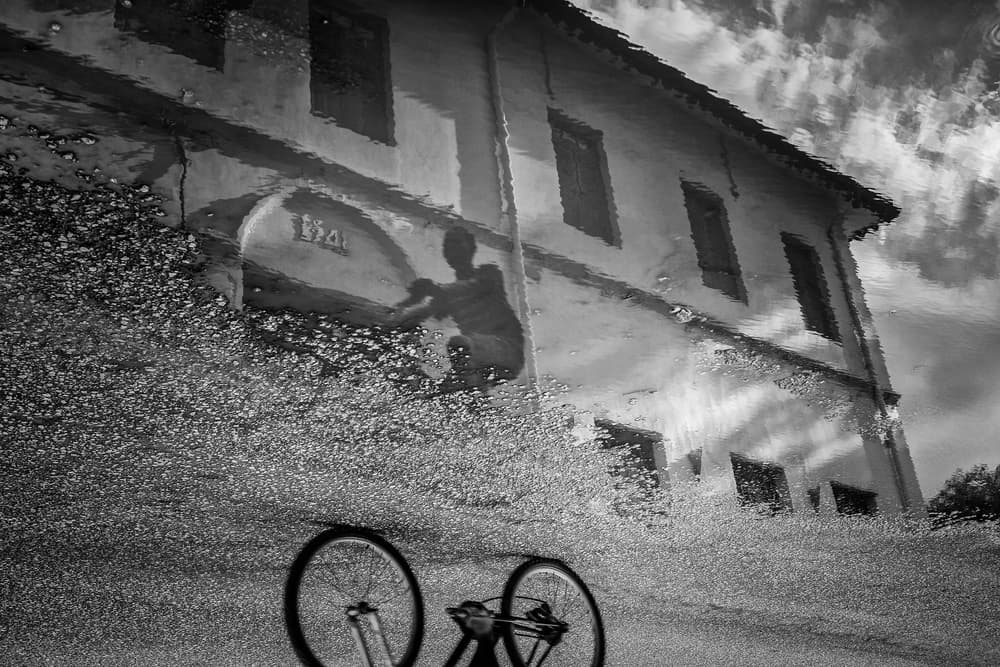 Bicycle Puddle Reflection by Gloria Salgado Gispert — canvas wall art