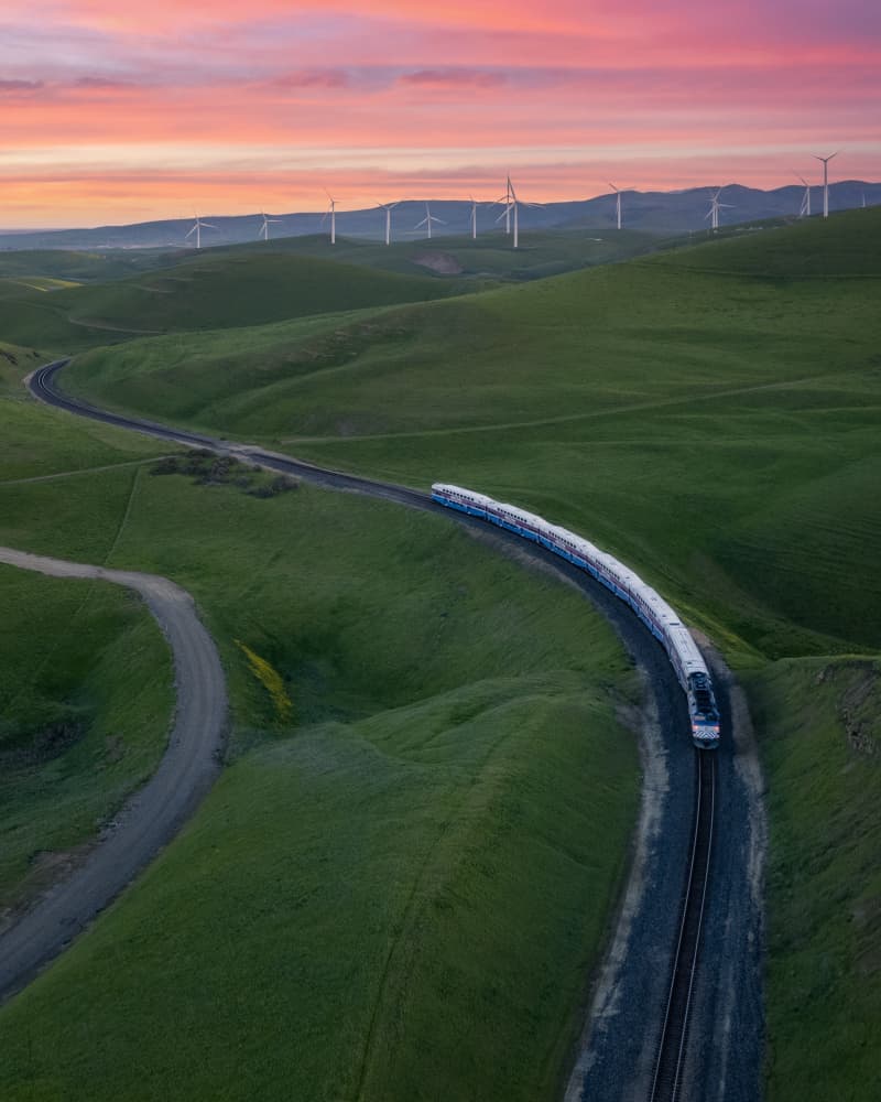 Sunset Train Through Hills by Bill Wang — canvas wall art