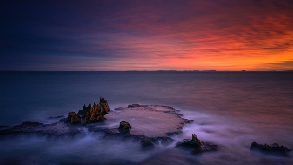 Dreamy Coastal Sunset by James Zhen Yu — canvas wall art