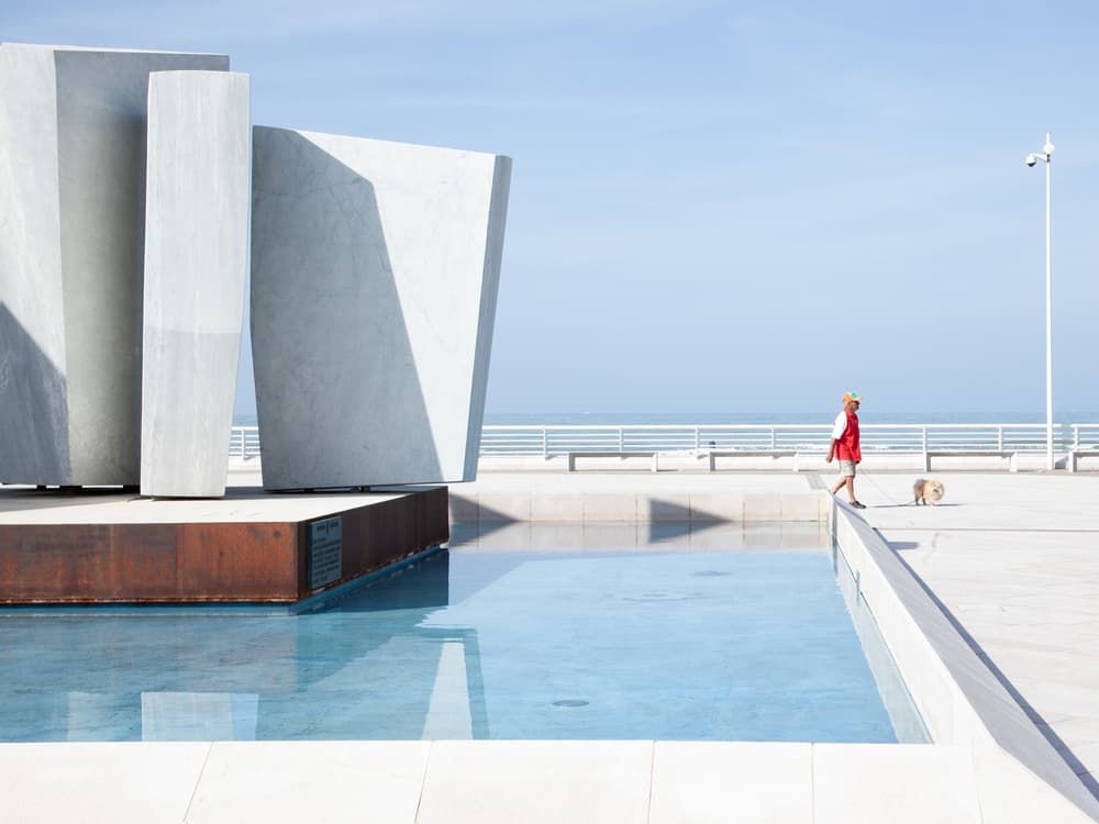 Seaside Walk with Modern Sculpture by Massimo Della Latta — canvas wall art