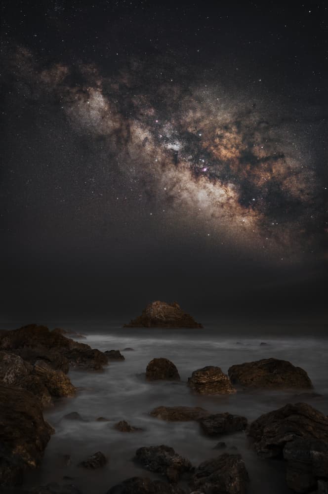 Milky Way Over Ocean Rocks by まちゅばら/Hiroki Matsubara — canvas wall art