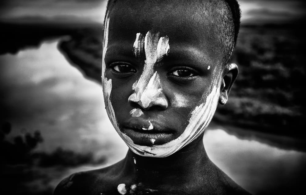 Young Boy Painted Face by Joxe Inazio Kuesta Garmendia — canvas wall art